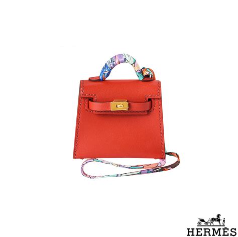 hermes metal bag charm|Hermes twilly on bag.